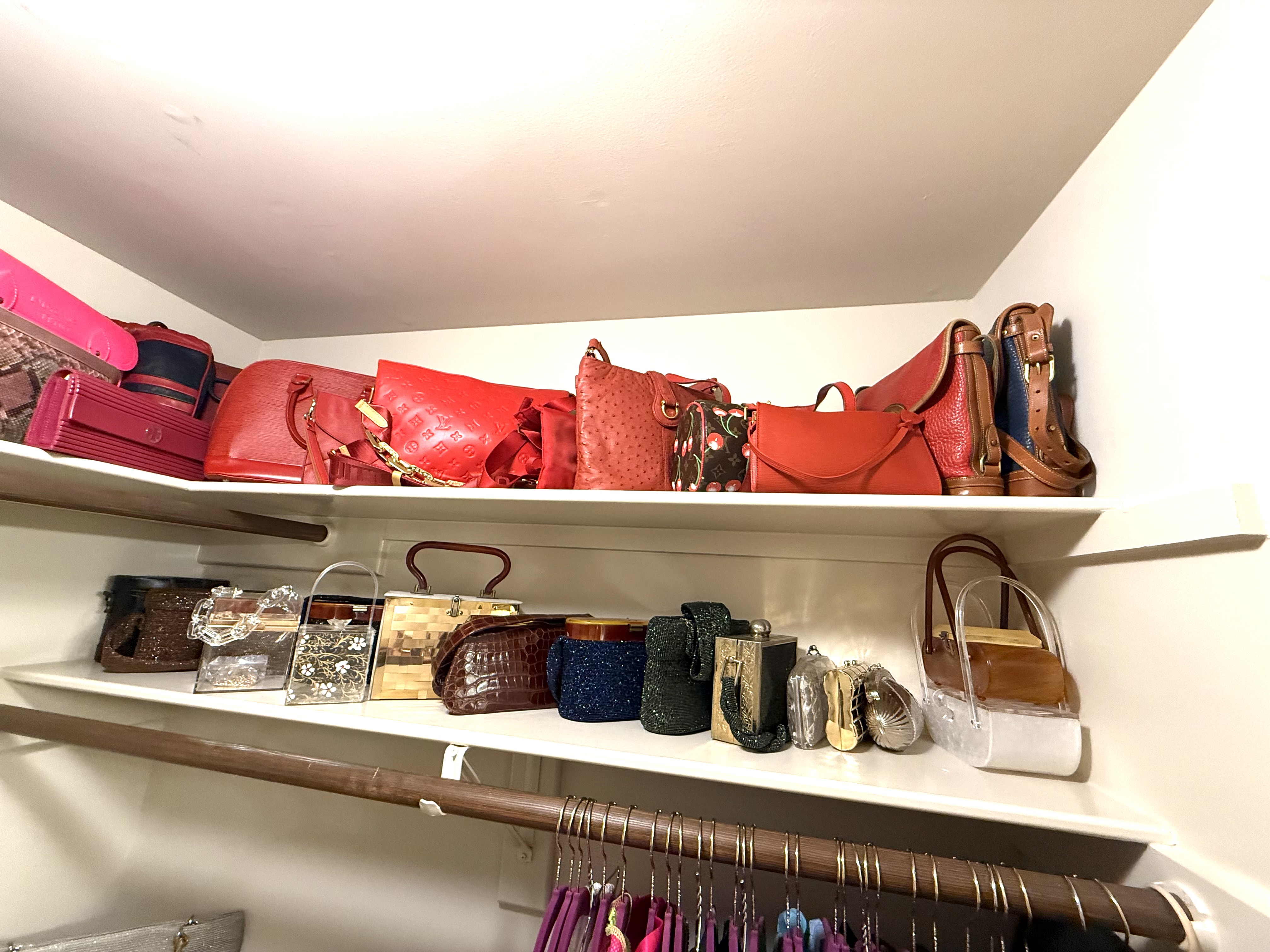 Closet shelving with a curated collection of designer handbags and vintage clutches